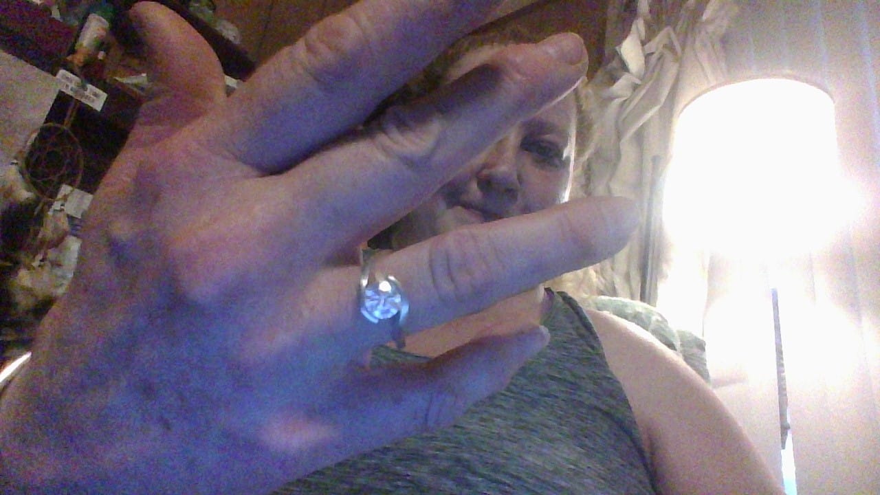 Customer photo review of Solitaire Tension Set Moissanite Bypass Engagement Ring