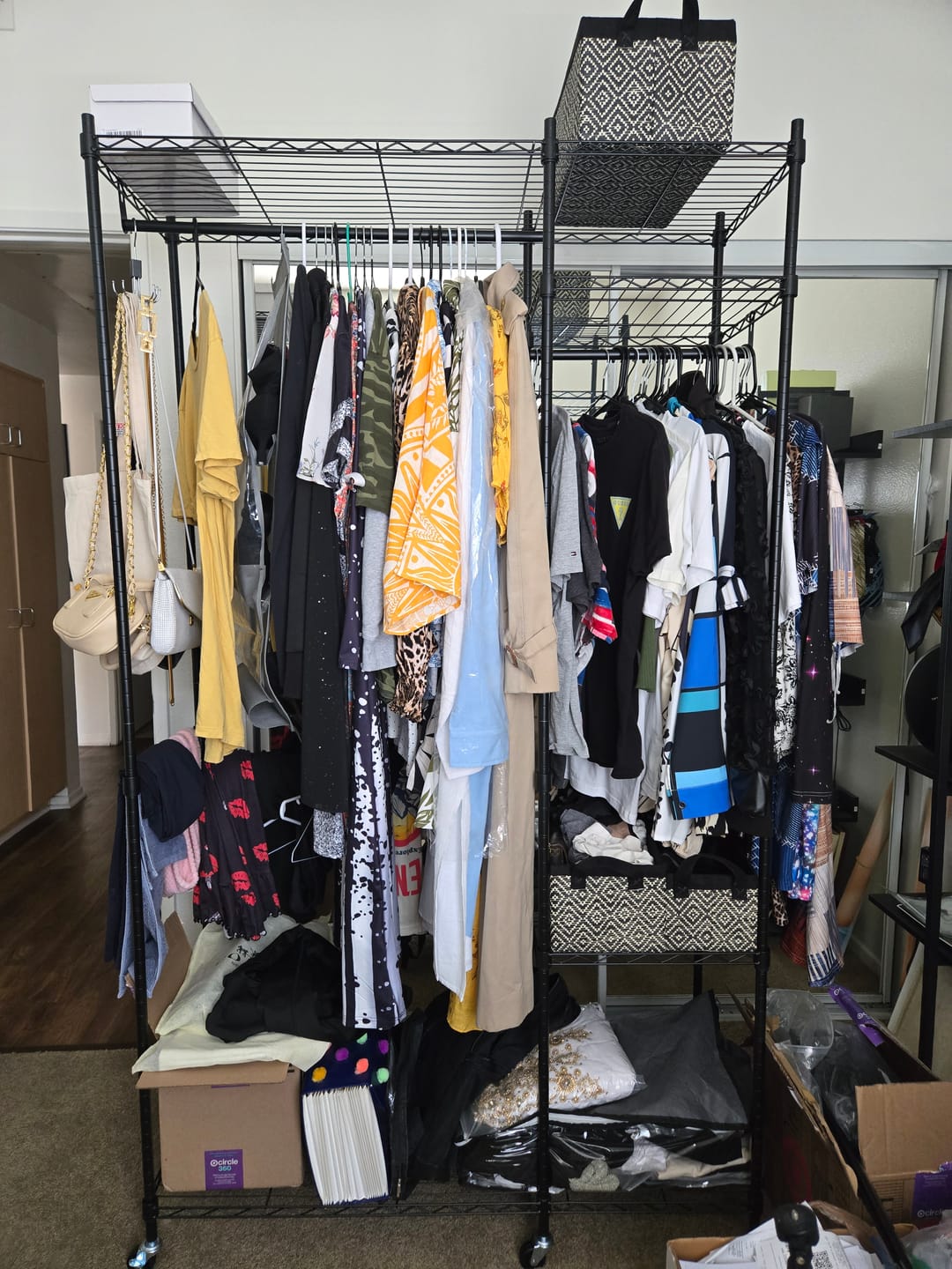 Customer photo review of Raybee Heavy Duty Portable Clothes Rack With Wheels,Clothing Rack For Hanging,Garment Rack For Bedroom