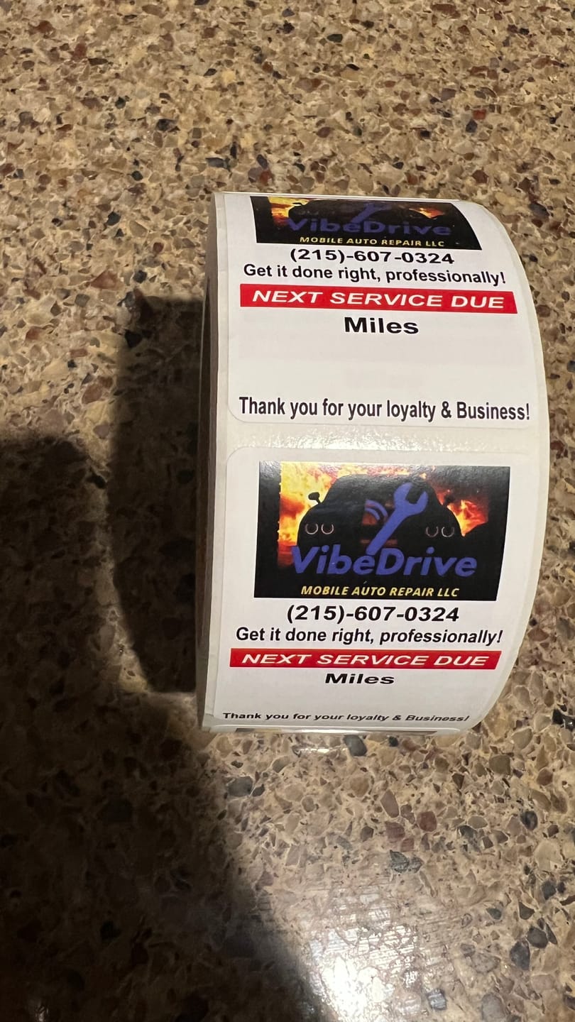 Customer photo review of Custom Oil Change Stickers for Windshield with Logo