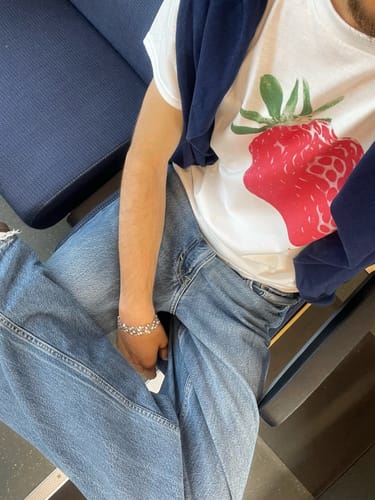 Customer photo review of strawberry fields baby tee