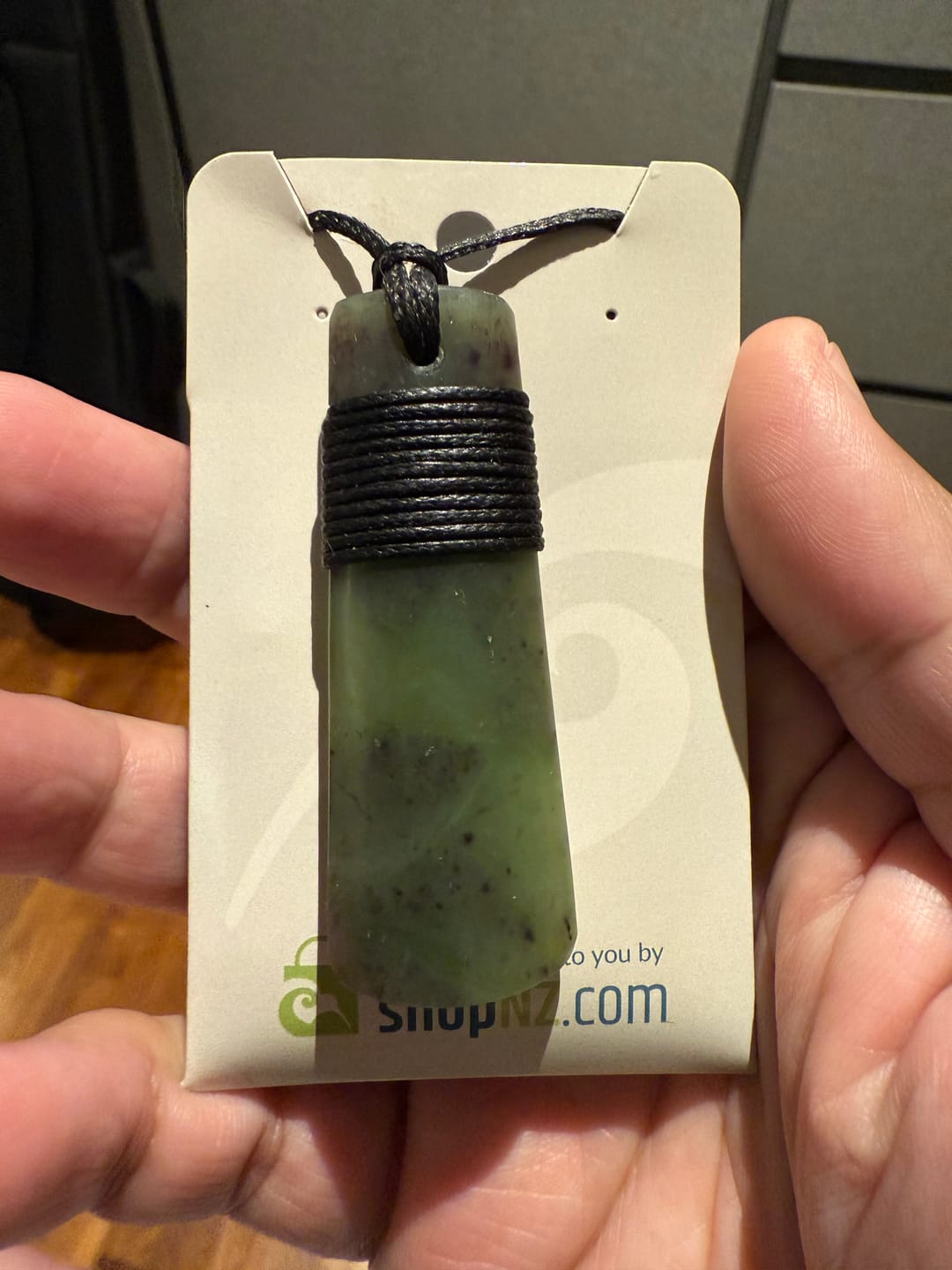 Customer photo review of Genuine Ngai Tahu Pounamu Wrapped Greenstone Toki Necklace 6cm