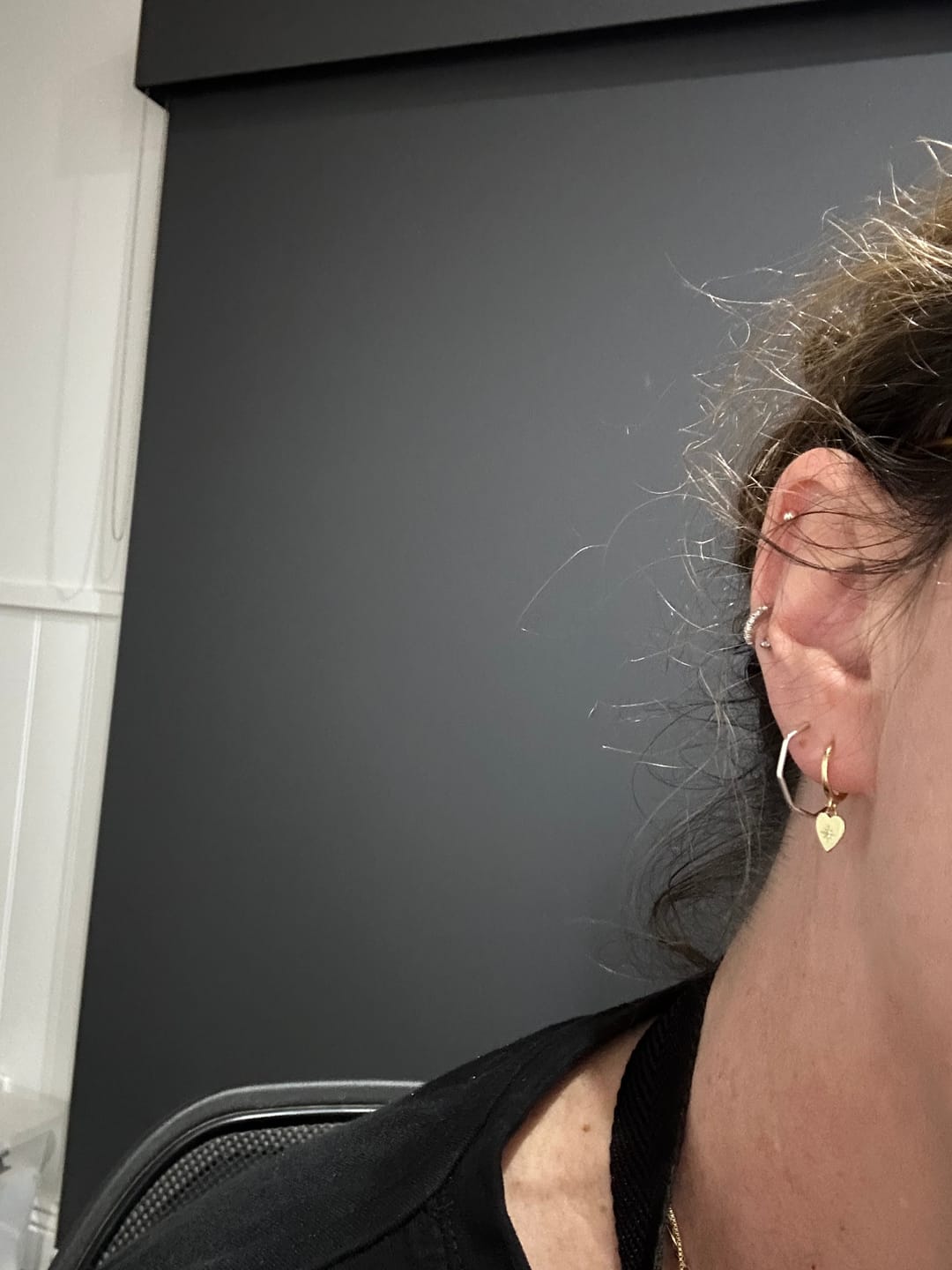 Customer photo review of North Star Heart Huggie Hoop Earrings