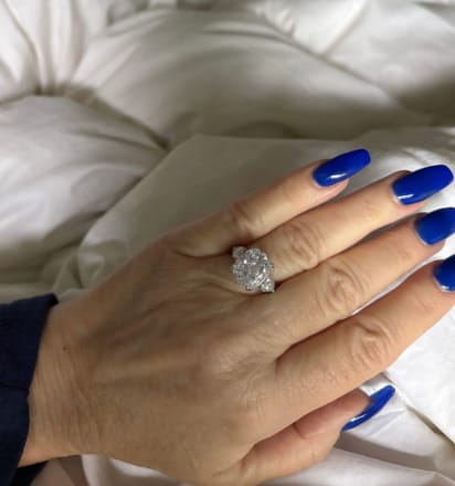 Customer photo review of Moissanite 6.0Ct Cushion Cut Three Stone Engagement Ring In Sterling Silver