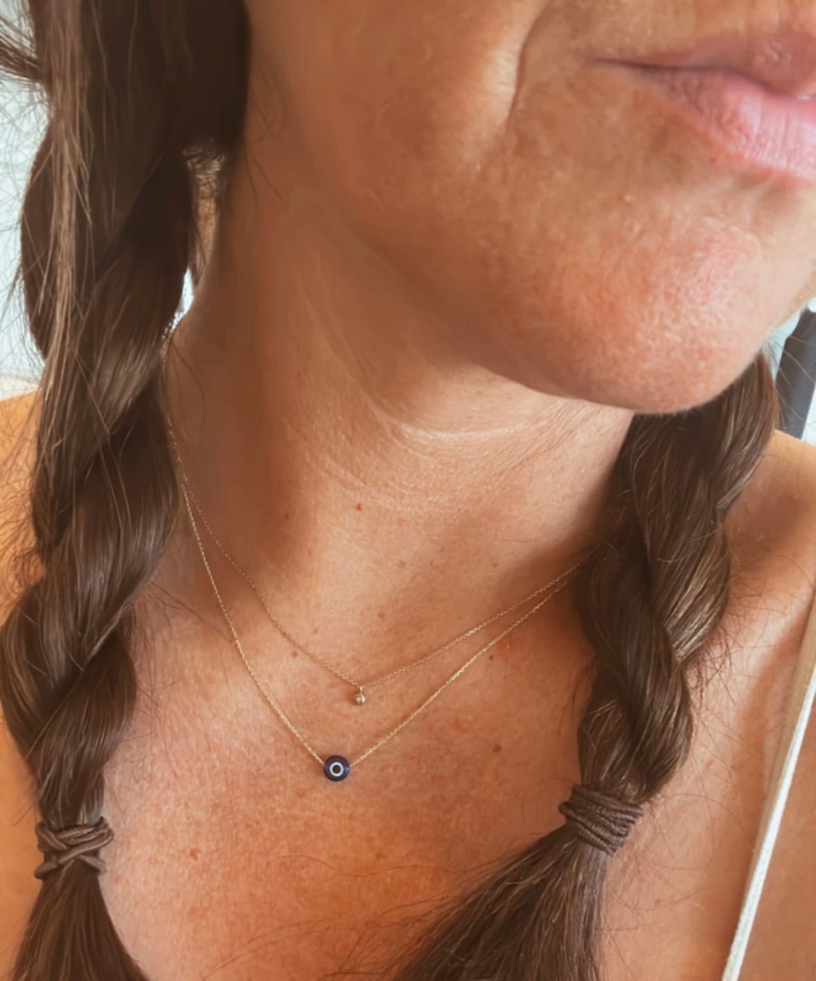 Customer photo review of MYKONOS EVIL EYE BLUE NECKLACE