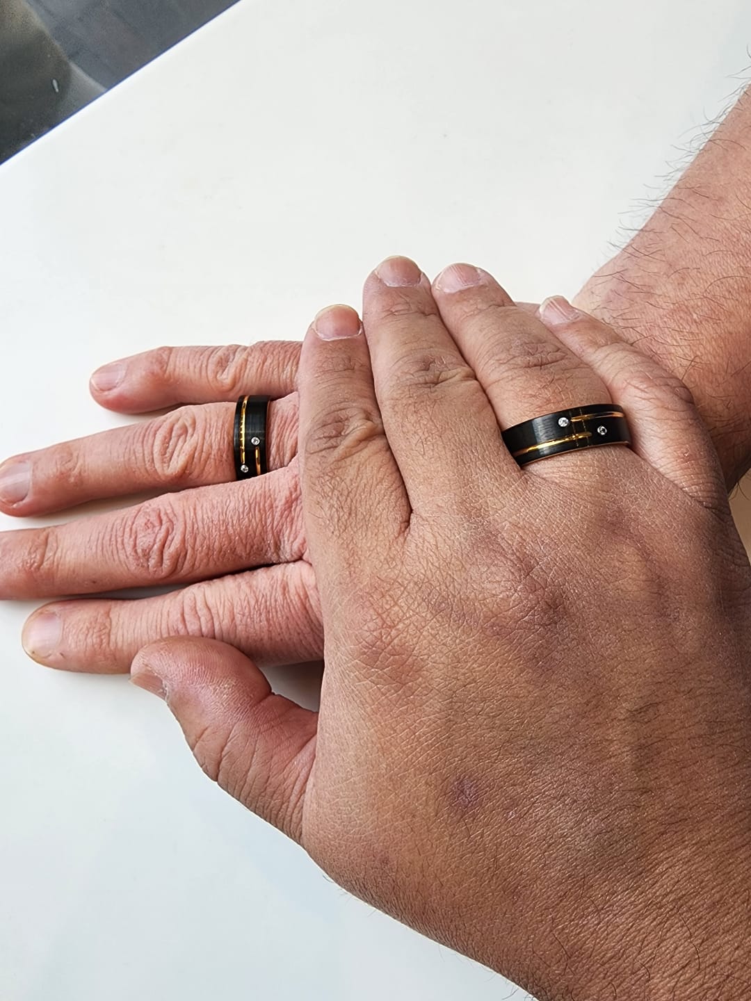 Customer photo review of Mens Black Tungsten Carbide Wedding Band with Gold Grooves 2 CZ Diamonds.