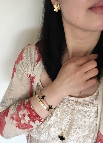 Customer photo review of FRIVOLE GOLD FLOWER EARRINGS