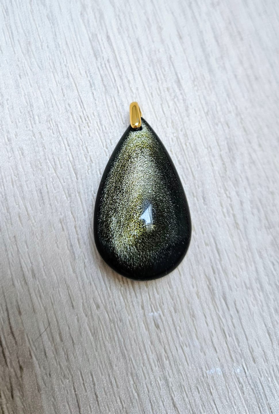 Customer photo review of Pendentif Obsidienne Dorée