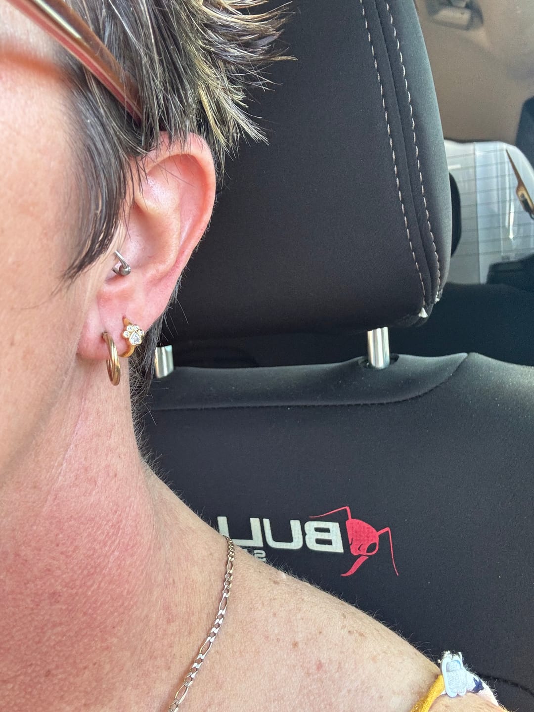 Customer photo review of Dog Paw Sapphire Huggie Earrings