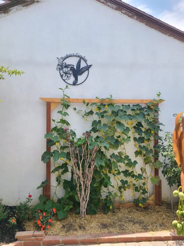 Customer photo review of Hummingbird Metal Garden Sign Decor