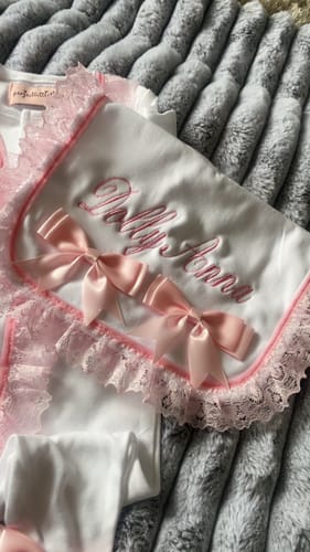 undefined review of Perfect Little Thing Baby Girls Handmade Frill Sleepsuit With Bib - Pink image 1 out of 2