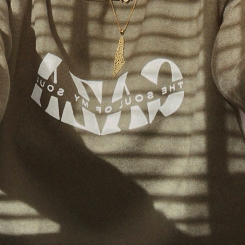 Customer photo review of Palestine Calligraphy Map Necklace
