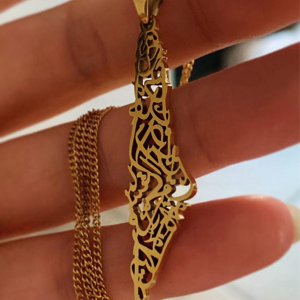 Customer photo review of Palestine Calligraphy Map Necklace