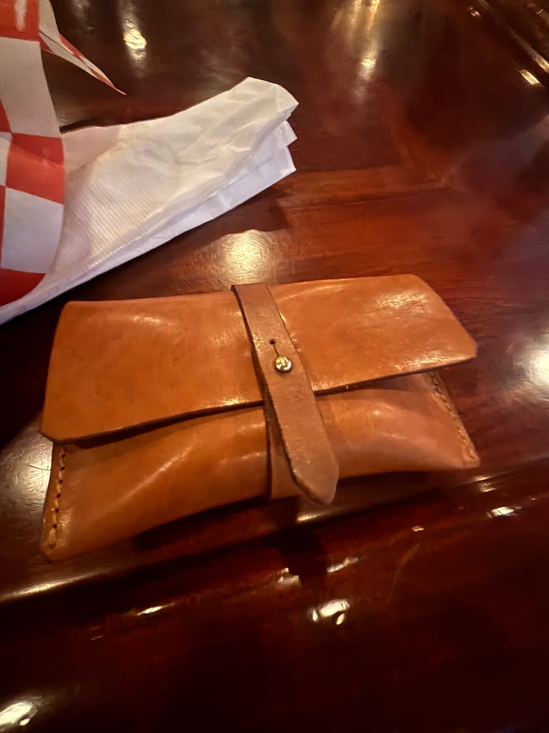 Courtney F. wearing the Leather Wrap Wallet