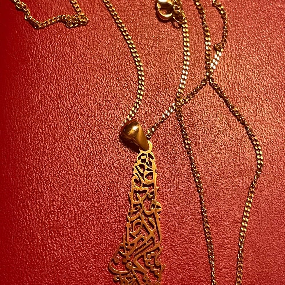 Customer photo review of Palestine Calligraphy Map Necklace