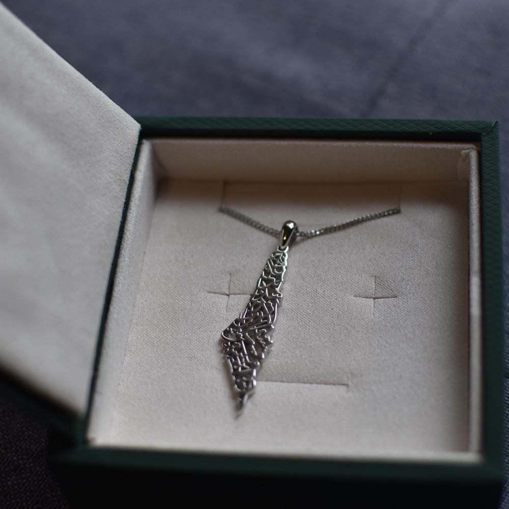 Customer photo review of Palestine Calligraphy Map Necklace