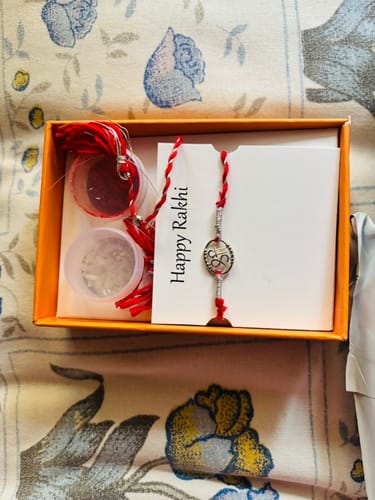 Customer photo review of Silver Heavenly Shree Rakhi