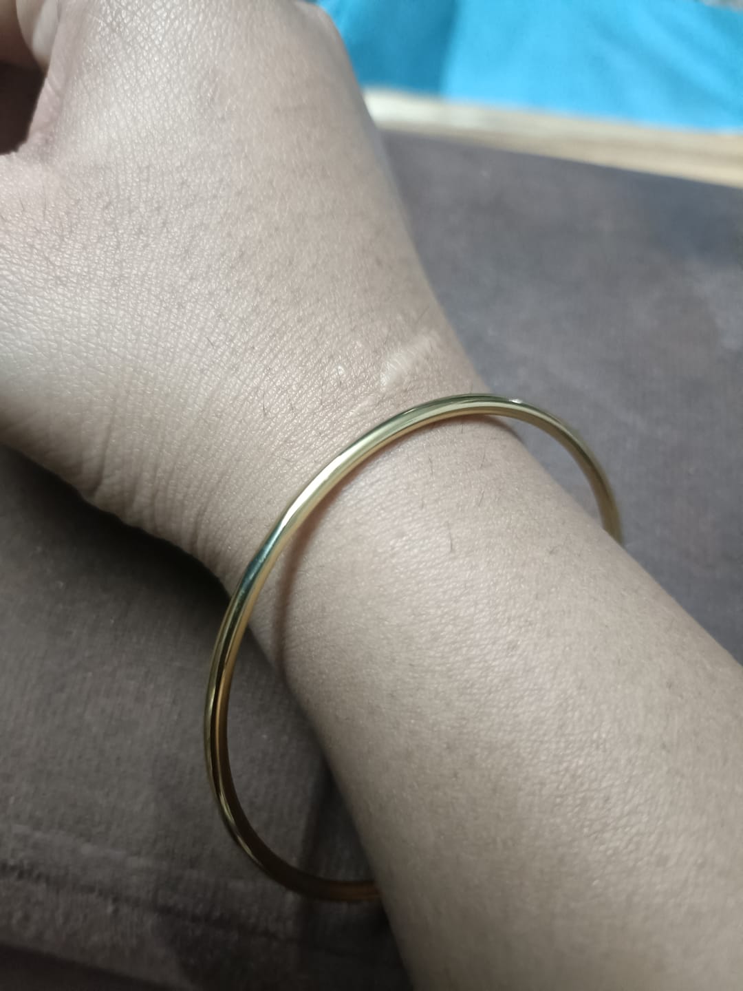 Customer photo review of Slim Gold Bangle
