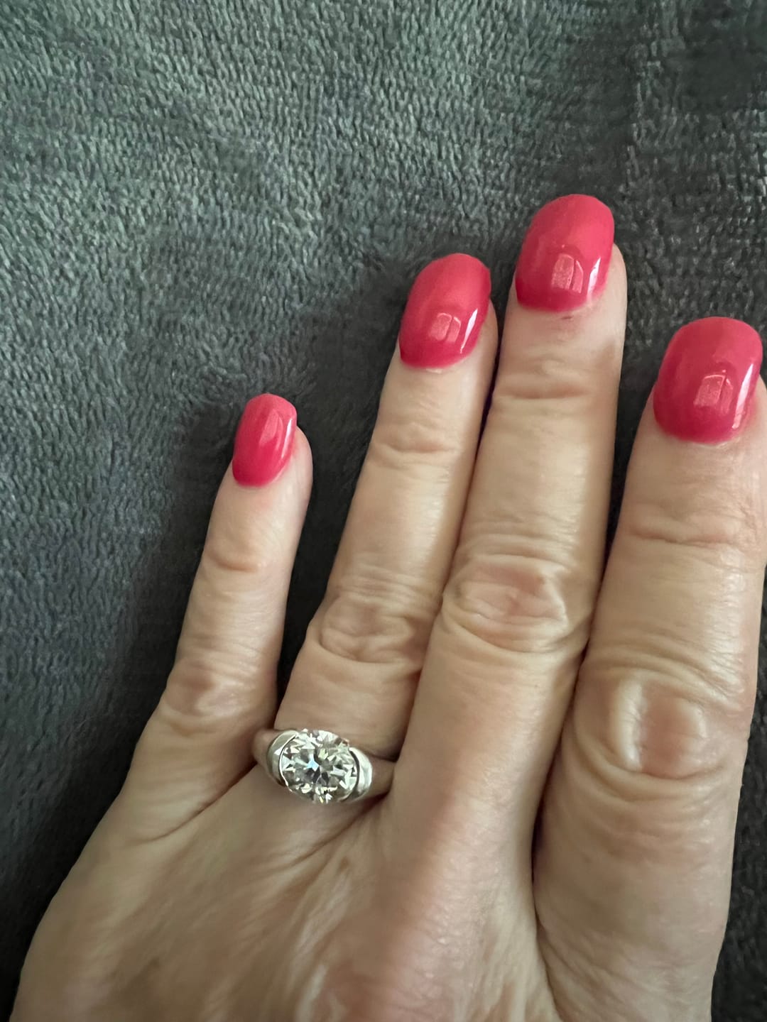 Customer photo review of Solitaire Oval Moissanite Half Bezel Set Engagement Ring