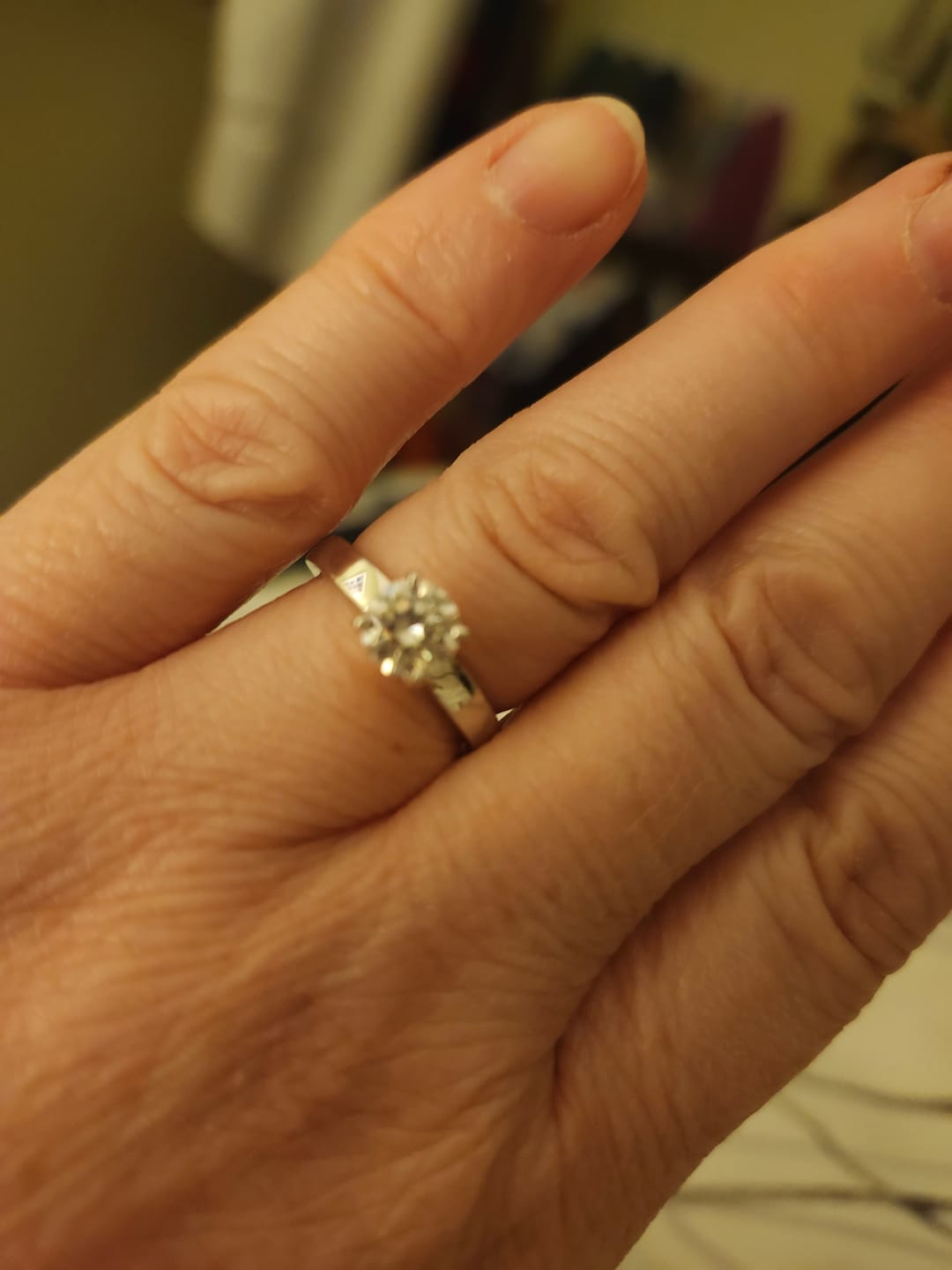 Customer photo review of Solitaire Moissanite Four Prong Flat Shank Engagement Ring