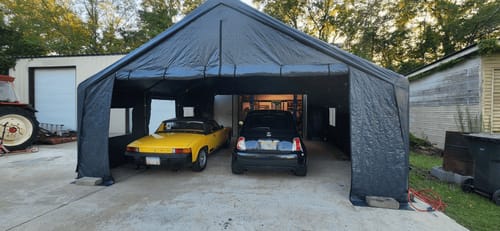 Customer photo review of REIBII 20x20 Heavy-Duty Carports for Two Car, Portable Carport Garage with 4 Windows and 3 Roll-up Doors, Waterproof Carport Canopy Protection UV50+
