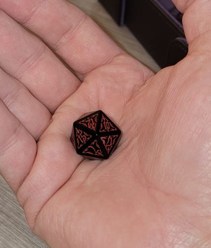 Customer photo review of URWizards D&D Obsidian Engraved Dice Set Blood Hunter Style