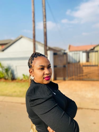 Customer photo review of Gold Luxe Mini Logo Hoops