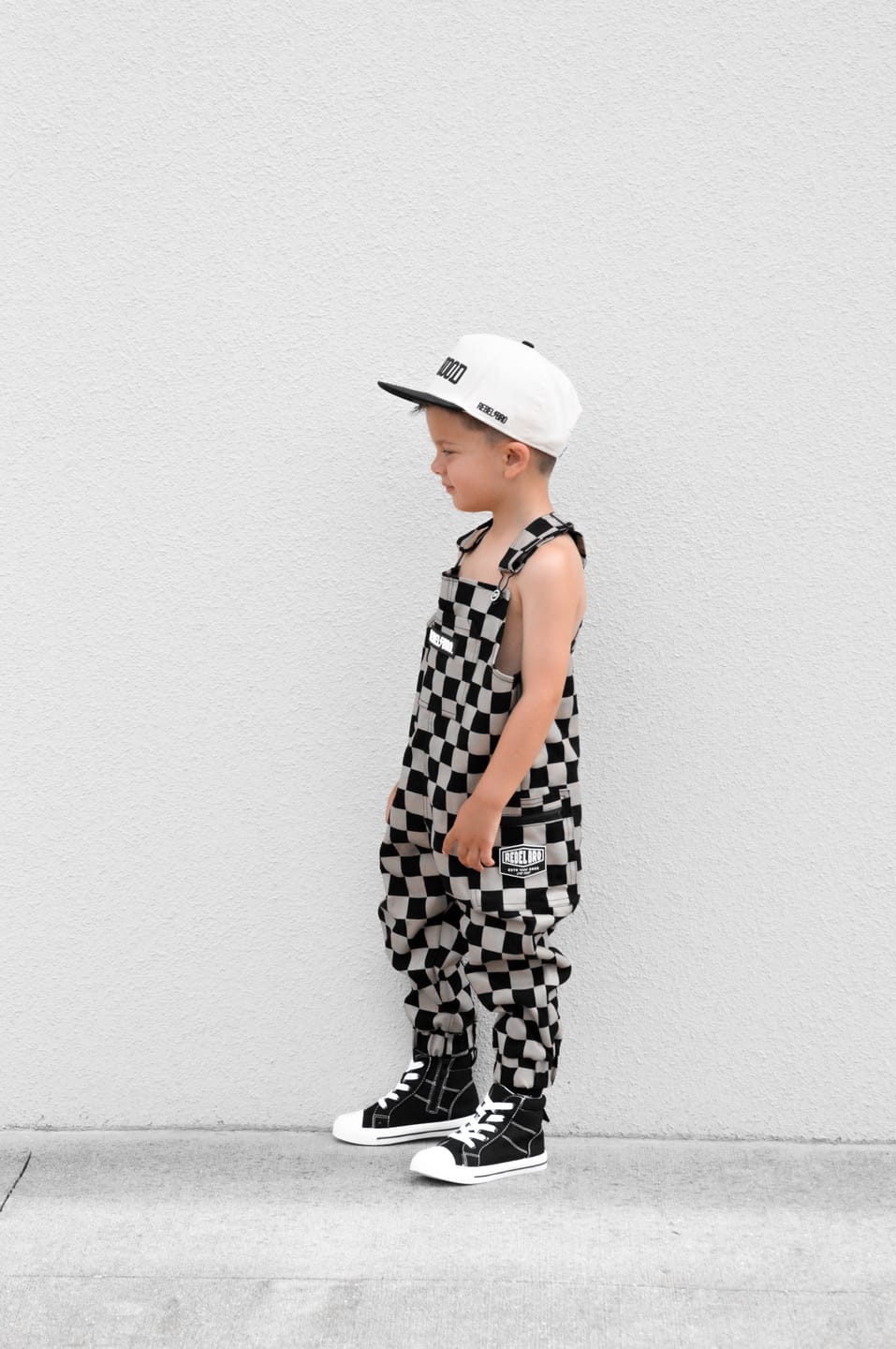 Customer photo review of The Live Fast Overall in Taupe + Black Checkered