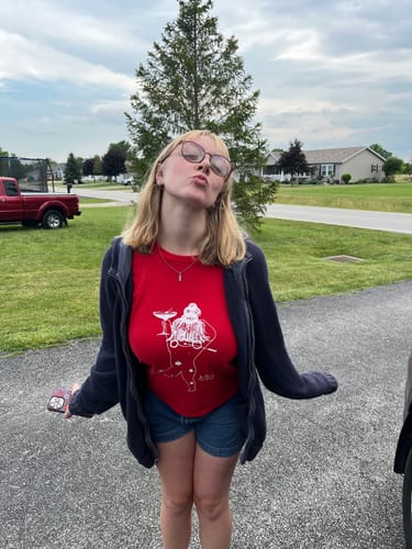 Customer photo review of reading is sexy baby tee