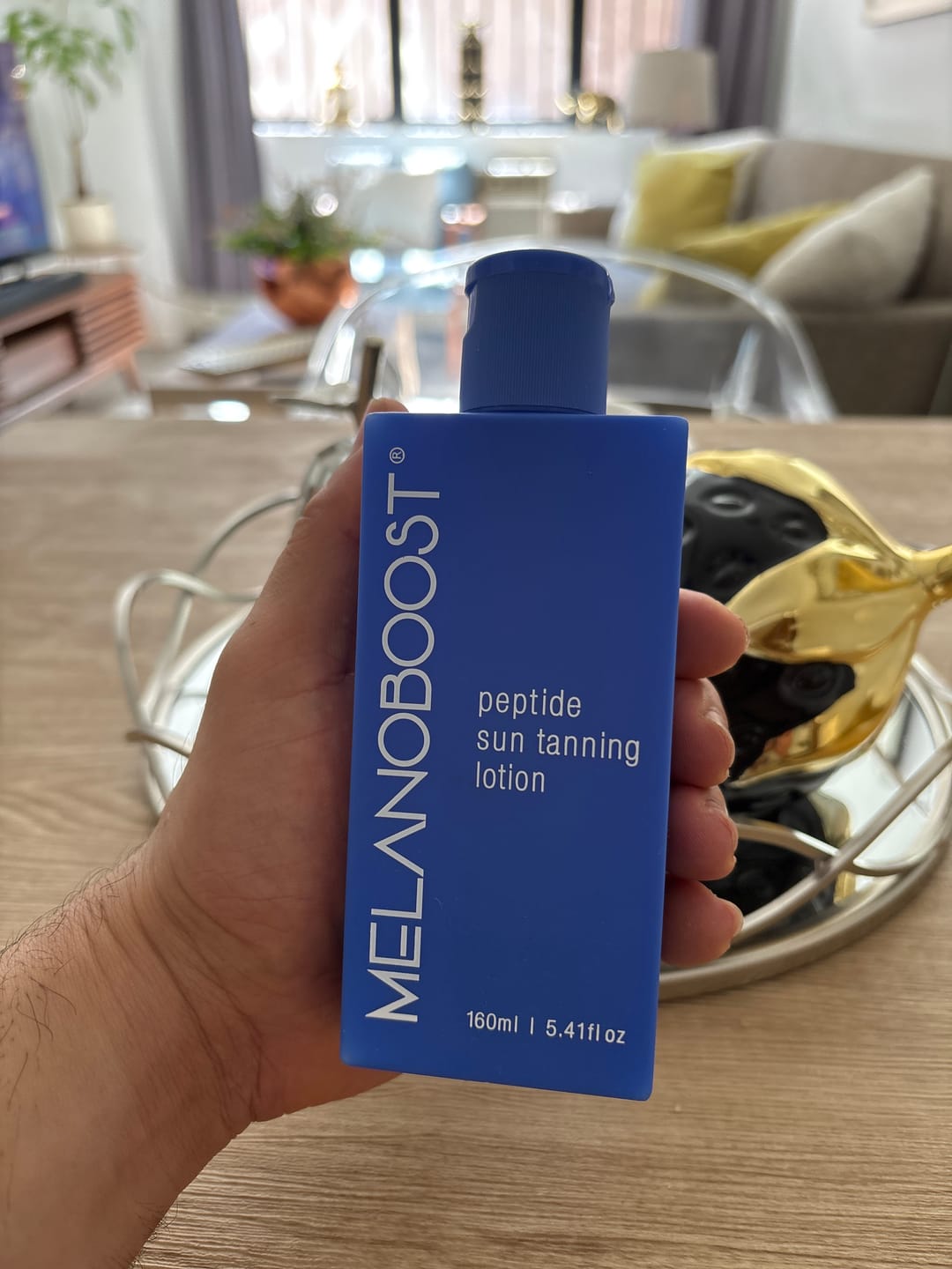 Customer photo review of Melanoboost Peptide Sun Tanning Lotion
