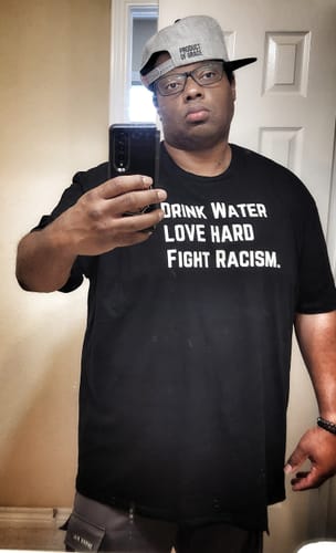 Customer photo review of Drink Water Fight Racism Unisex T-shirt