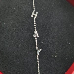 Customer photo review of 14K Solid Gold Sideways Letter Necklace