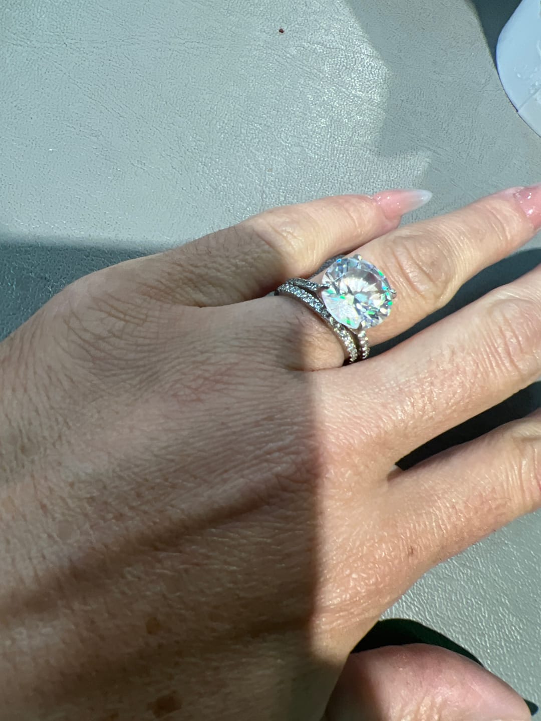Customer photo review of S925 Half Halo Moissanite 0.5 Ct Round Cut White/Green Stone Anniversary Ring