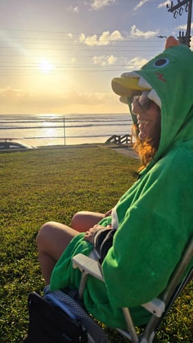 Customer photo review of OLAOLA Green Dinosaur Surf Poncho Changing Towel Swim Robe Quick Dry Terry Cloth Cover-Up Hood Blanket Beach Towels