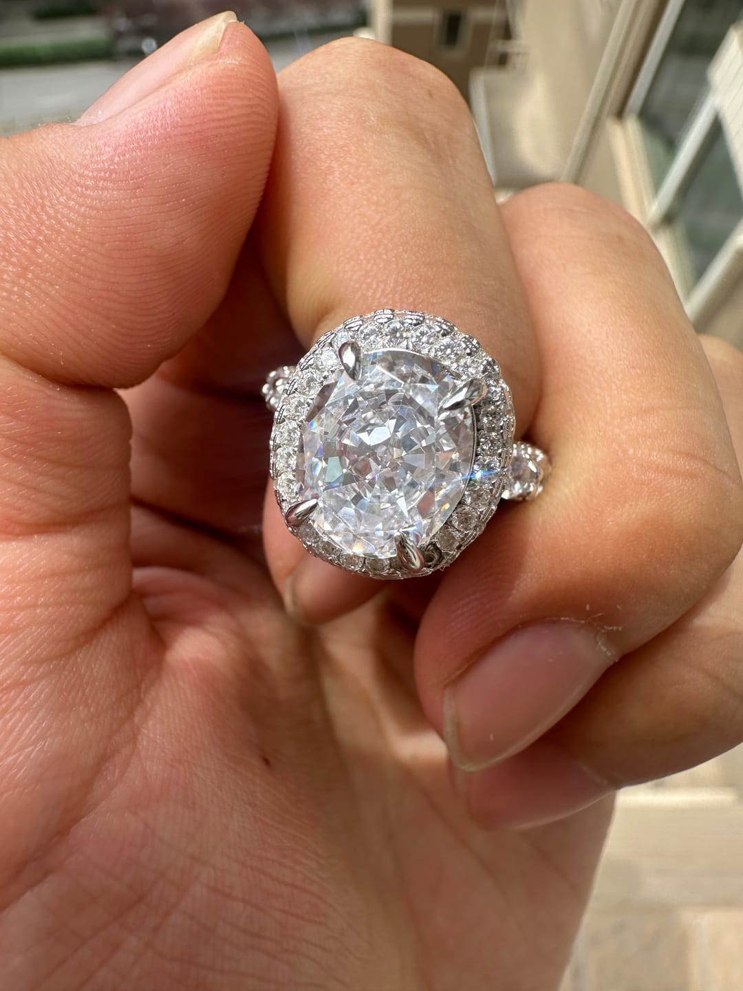Customer photo review of Gorgeous Hidden Halo Oval Cut 4.0ct Engagement Ring In Sterling Silver