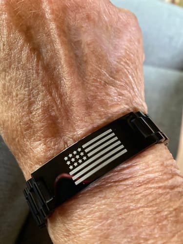 Customer photo review of Never Surrender Patriot Bracelet: Helps Pair Veterans With A Service Dog Or Shelter Dog