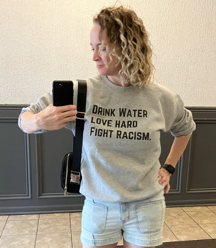 Customer photo review of Drink Water Fight Racism Sweatshirt