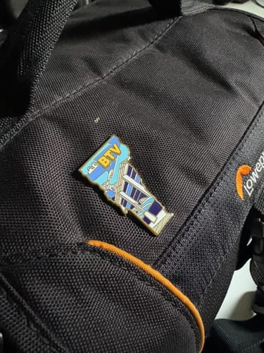 Customer photo review of Airport Enamel Pin | BTV - Vermont