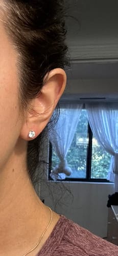Customer photo review of M & Co. 3-Prong Martini Setting Diamond Stud Earrings