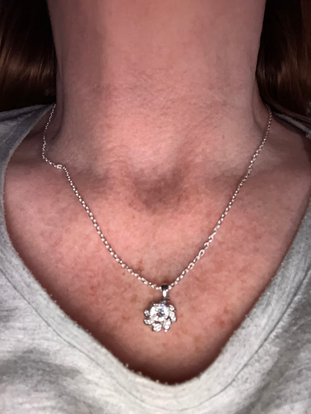Customer photo review of White Gold 1ct Moissanite Flower Silver Dazzle Pendant Necklace