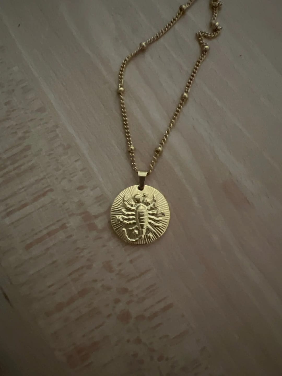 Customer photo review of STERNZEICHEN 18k Gold - Halskette