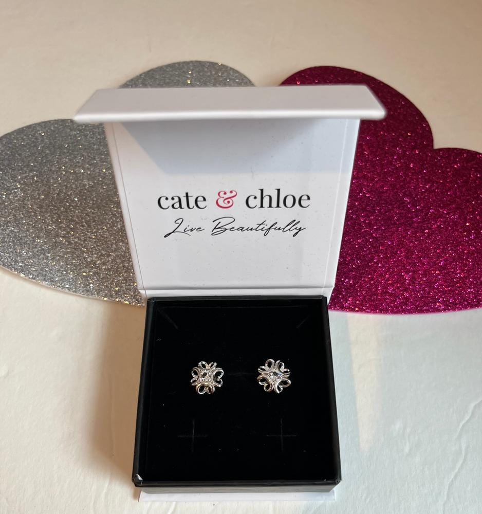 Customer photo review of Alexis 18k White Gold Plated Flower Stud Earrings with Swarovski Crystals