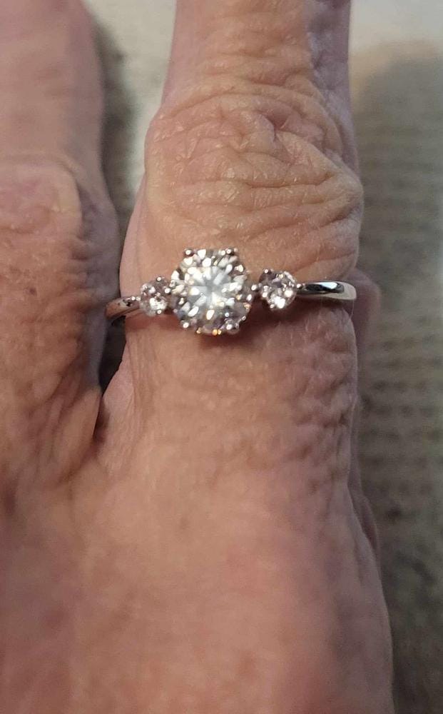 Customer photo review of Moissanite by Cate & Chloe Sarah 1.22tcw Round Cut 925 Sterling Silver 18k White Gold Plated Engagement Ring