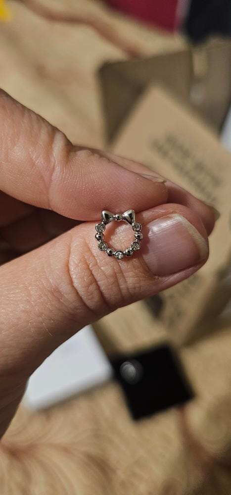 Customer photo review of Edith 18k White Gold Plated Silver Ribbon Stud Earrings with Swarovski Crystals