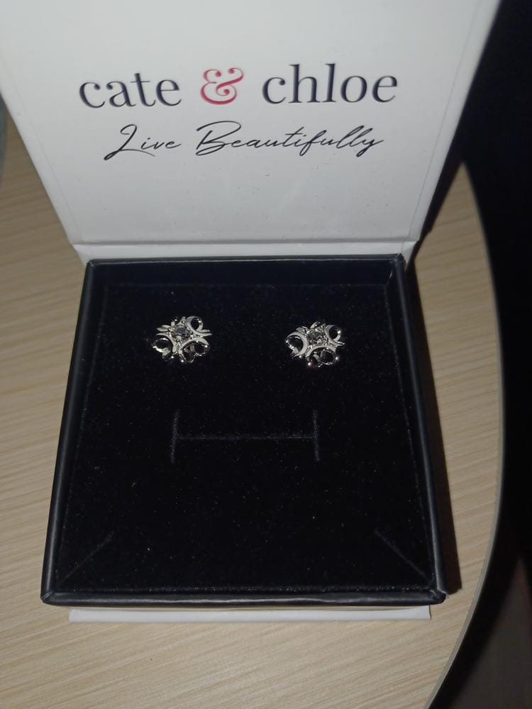 Customer photo review of Alexis 18k White Gold Plated Flower Stud Earrings with Swarovski Crystals