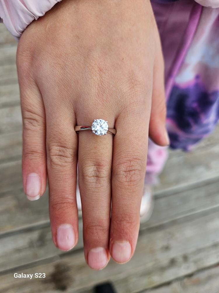 Customer photo review of Moissanite by Cate & Chloe Abigail 1.0tcw Round Cut 925 Sterling Silver 18k White Gold Plated Engagement Ring