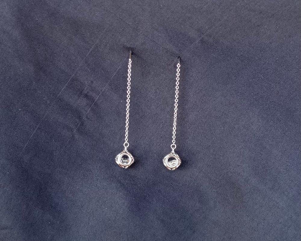 Customer photo review of Lena 18k White Gold Dangle Earrings with Swarovski Crystals