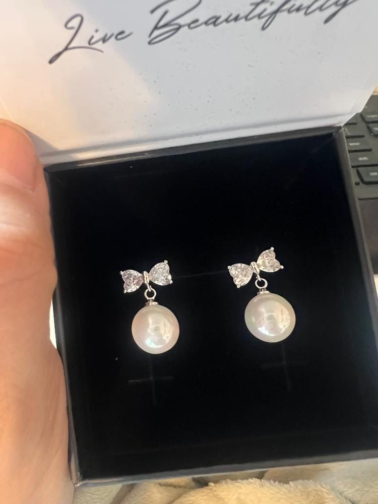 Customer photo review of Oakley 18k White Gold Plated Silver Drop Pearl Earrings with Swarovski Crystals