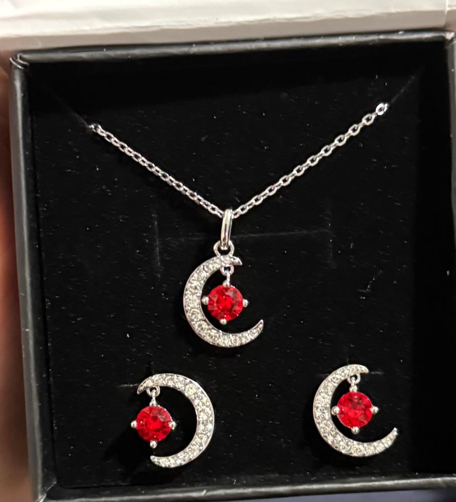 Customer photo review of Luna Birthstone Necklace 18k White Gold Plated Crescent Pendant Necklace with Round Cut Swarovski Crystals
