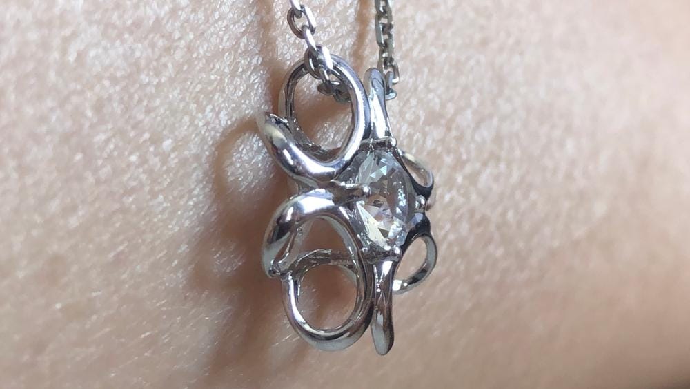 Customer photo review of Alexis 18k White Gold Plated Flower Pendant Necklace with Swarovski Crystal