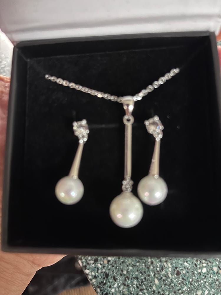Customer photo review of Tatum 18k White Gold Plated Pearl Dangling Stud Earrings with Swarovski Crystal